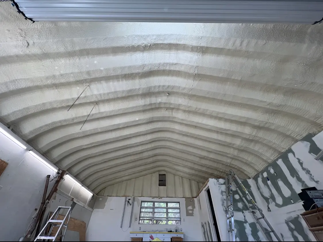 Spray polyurethane foam applied to the underside of a metal roof deck in Bonadelle Ranchos